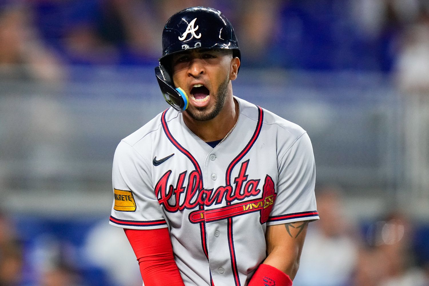 Sep 17, 2023; Miami, Florida, USA; Atlanta Braves outfielder Eddie Rosario (8) reacts to being hit by a pitch from Miami Marlins starting pitcher Jesus Luzardo (not pictured) during the fourth inning at loanDepot Park.